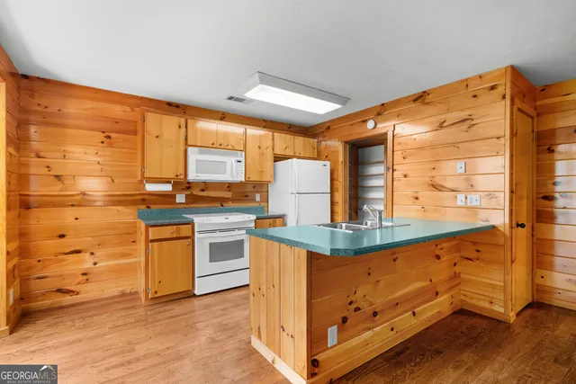 a view of dirt yard with a large tree