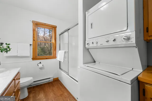a view of backyard with a tub and potted plants