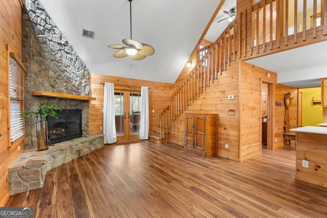 a view of a room with wooden floor