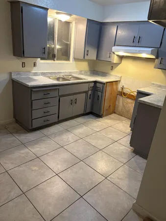 a bathroom with a sink vanity and mirror
