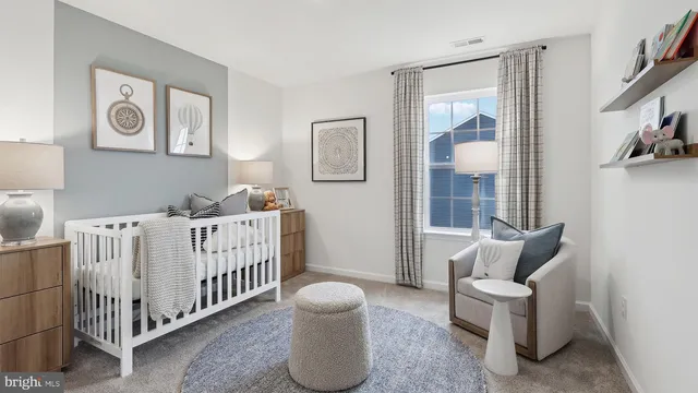 a bedroom with a bed and a night stand