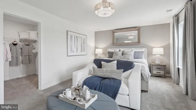 a bedroom with furniture and a window