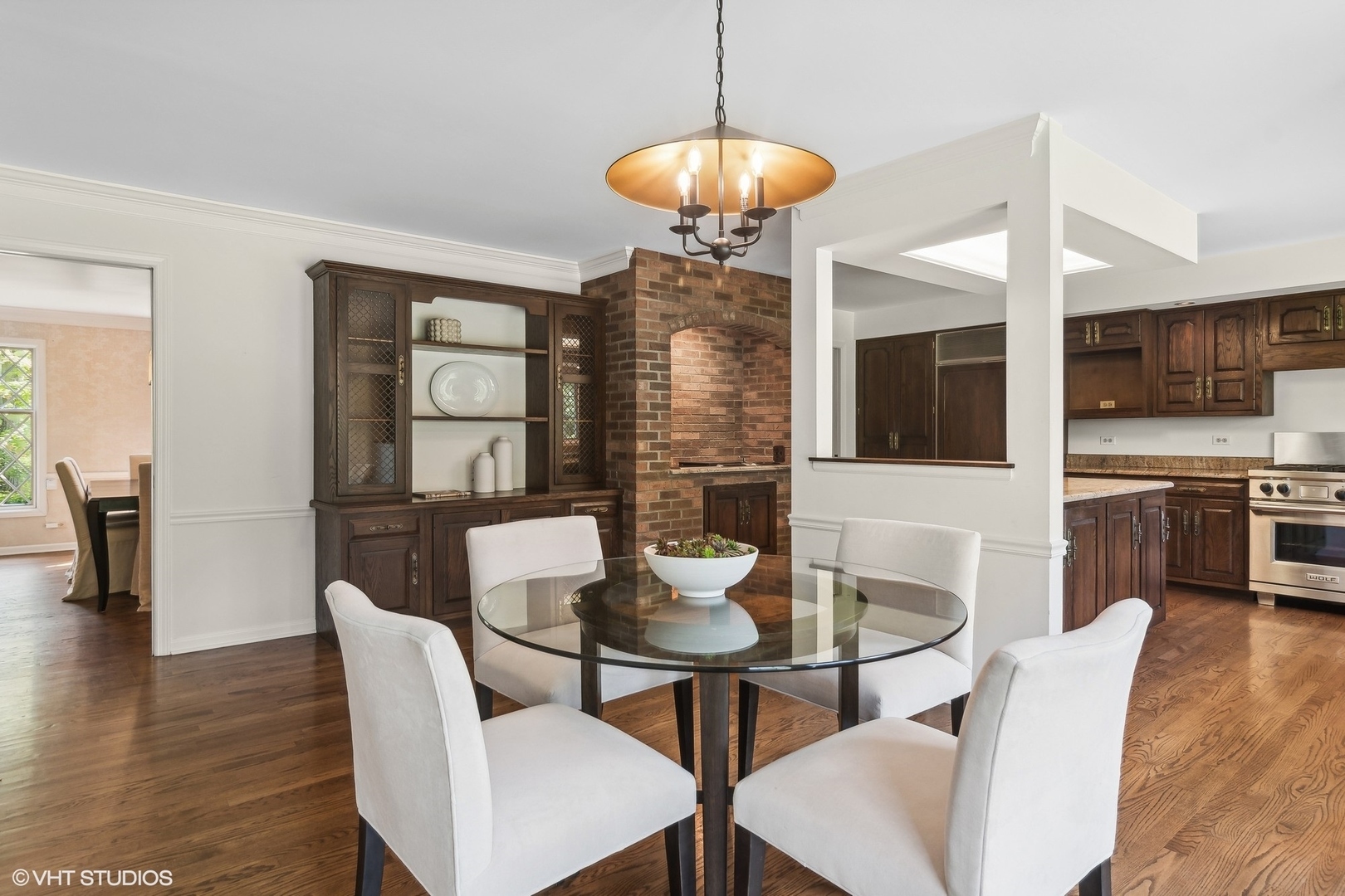 508 Forest Cove Road Lake Bluff, IL 60044 - Photo 12 of 38 a dining room with furniture a chandelier and wooden floor
