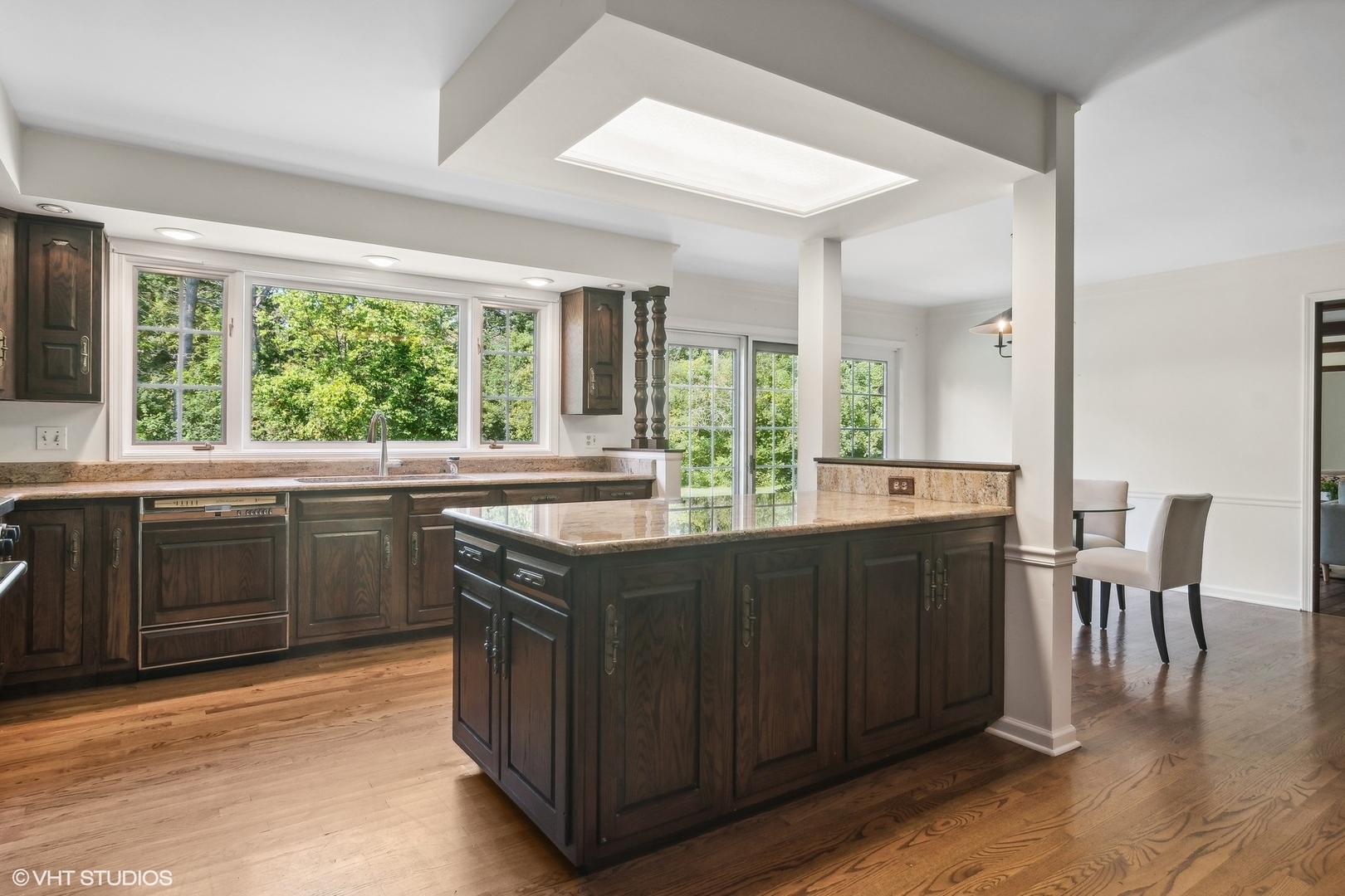 508 Forest Cove Road Lake Bluff, IL 60044 - Photo 19 of 38 a kitchen with a sink and wooden cabinets