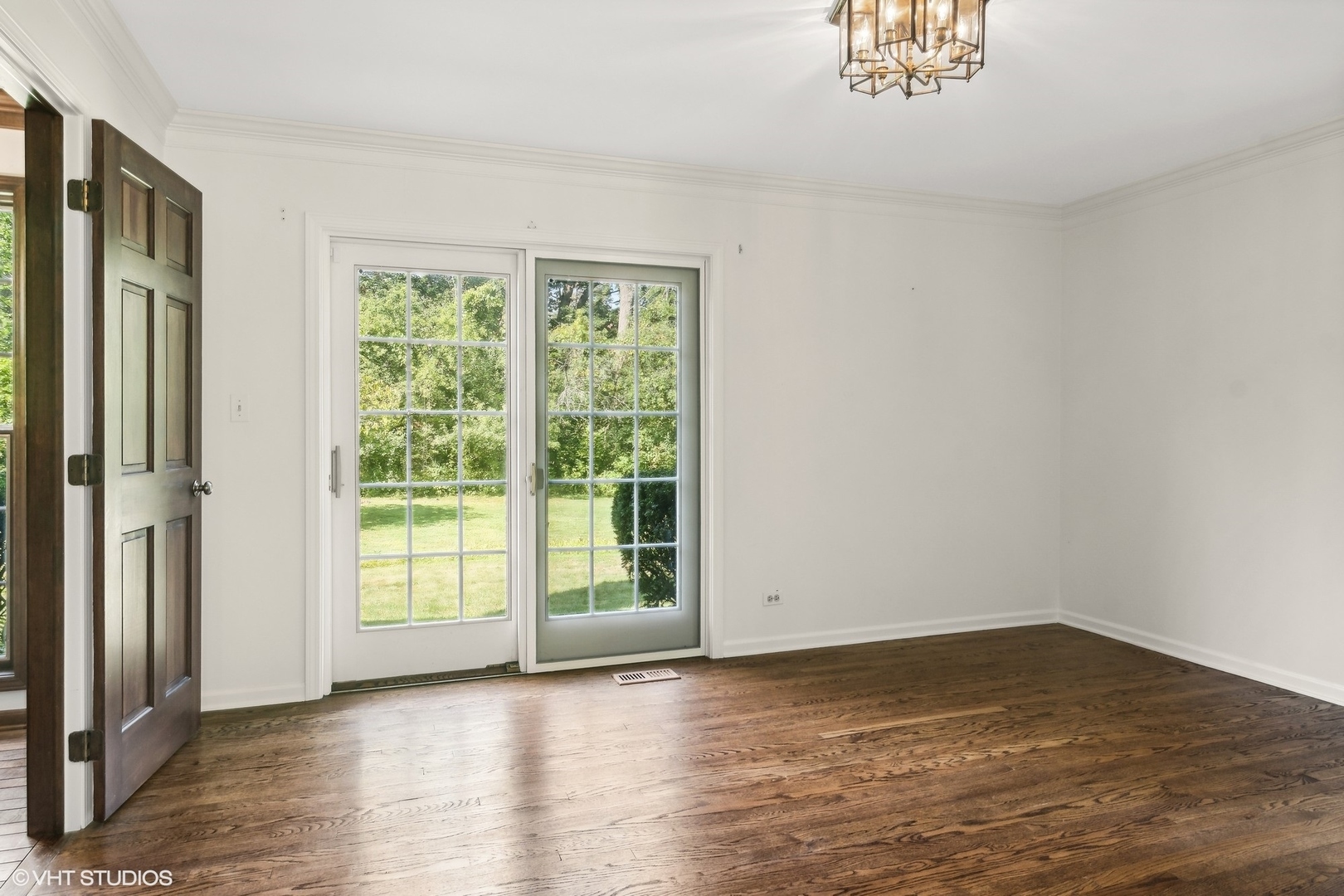 508 Forest Cove Road Lake Bluff, IL 60044 - Photo 8 of 38 a view of an empty room with wooden floor and a window