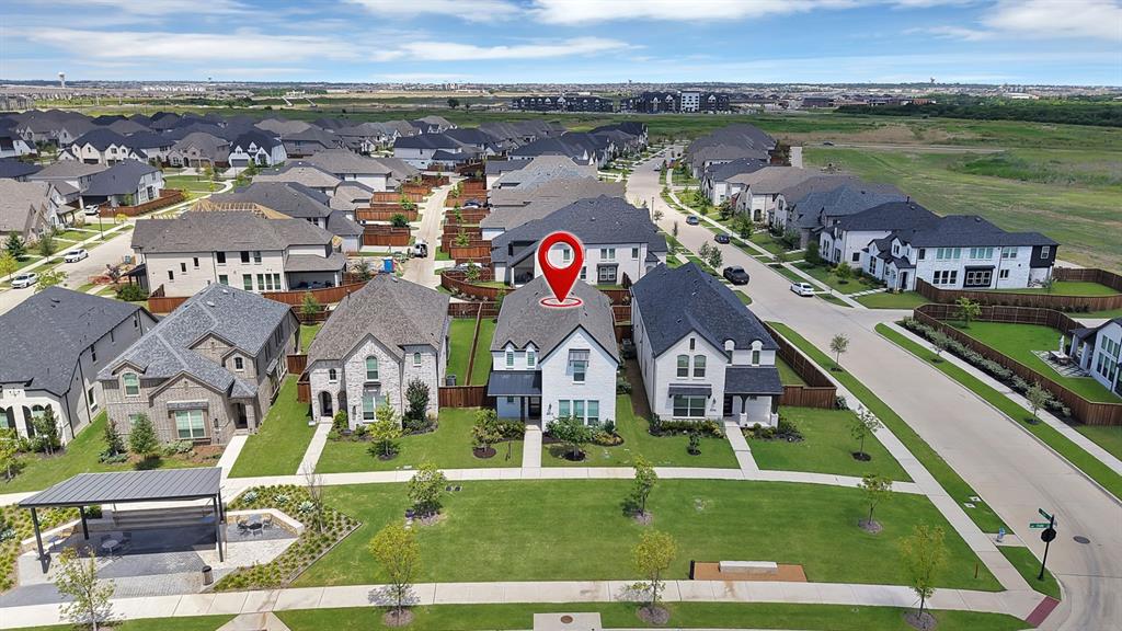 5012 Triadic Lane Prosper, TX 75078 - Photo 5 of 38 Contemporary two-story residence with white siding and dark roofing