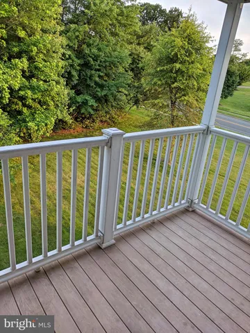 a view of balcony with wooden floor
