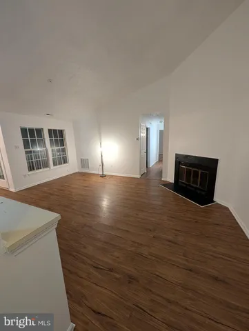 a bedroom with a bed and a night stand