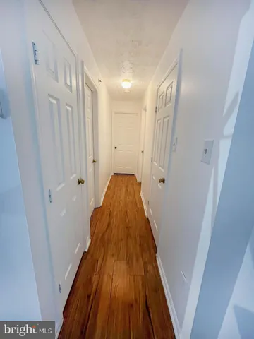 a bathroom with a toilet a sink and a mirror