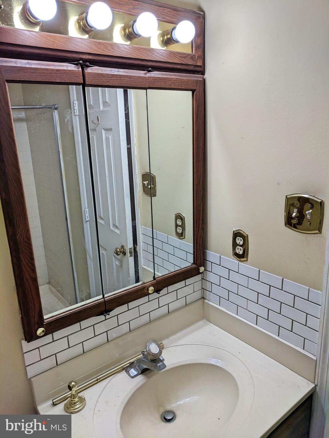 1301 L Cedar Crest Court, Unit 1301L Edgewood, MD 21040 - Photo 25 of 43 a bathroom with a sink and a mirror