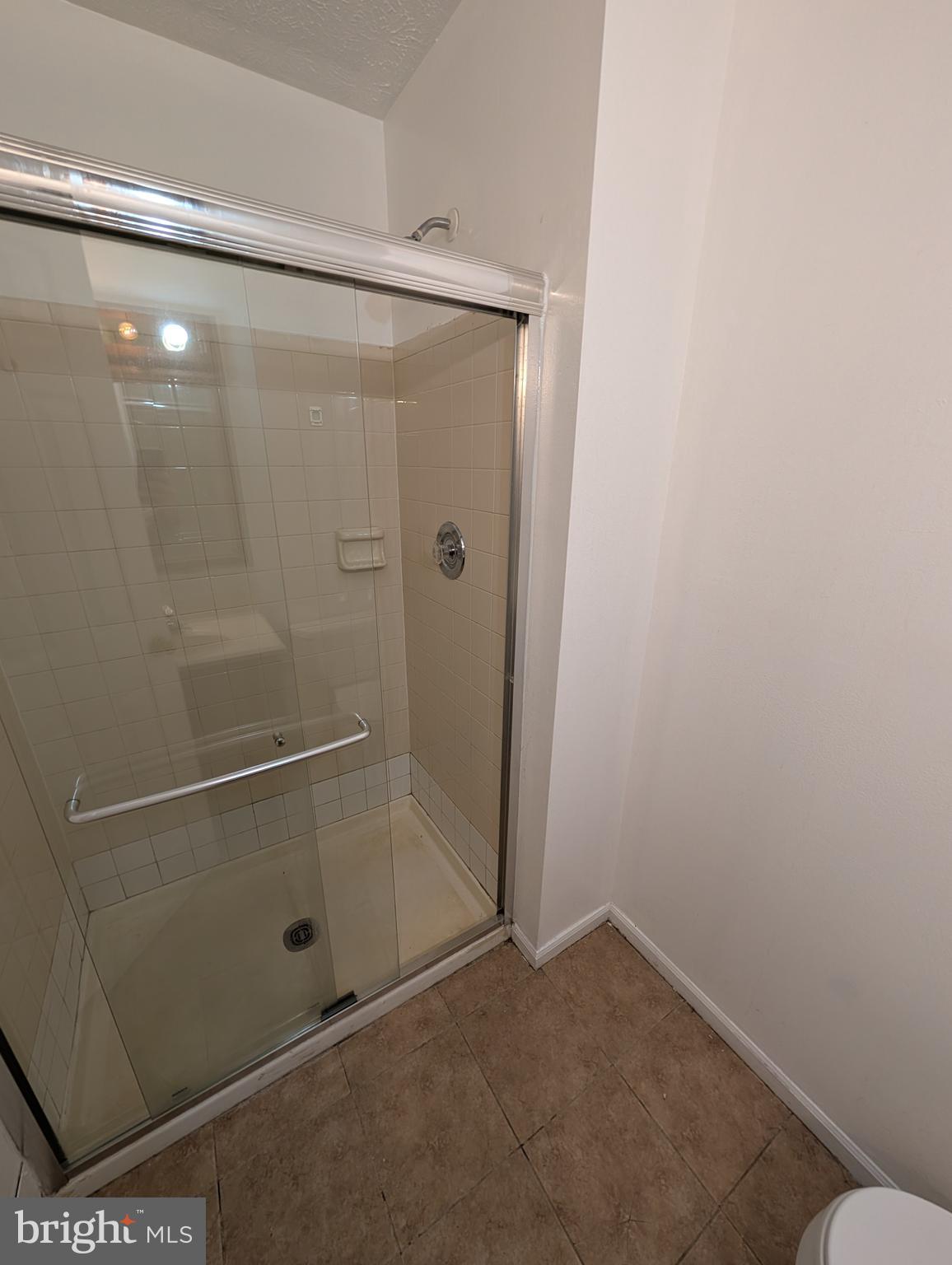1301 L Cedar Crest Court, Unit 1301L Edgewood, MD 21040 - Photo 26 of 43 a bathroom with a glass shower door