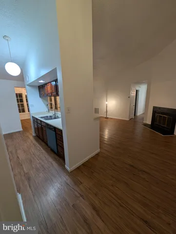 a room with furniture and wooden floor