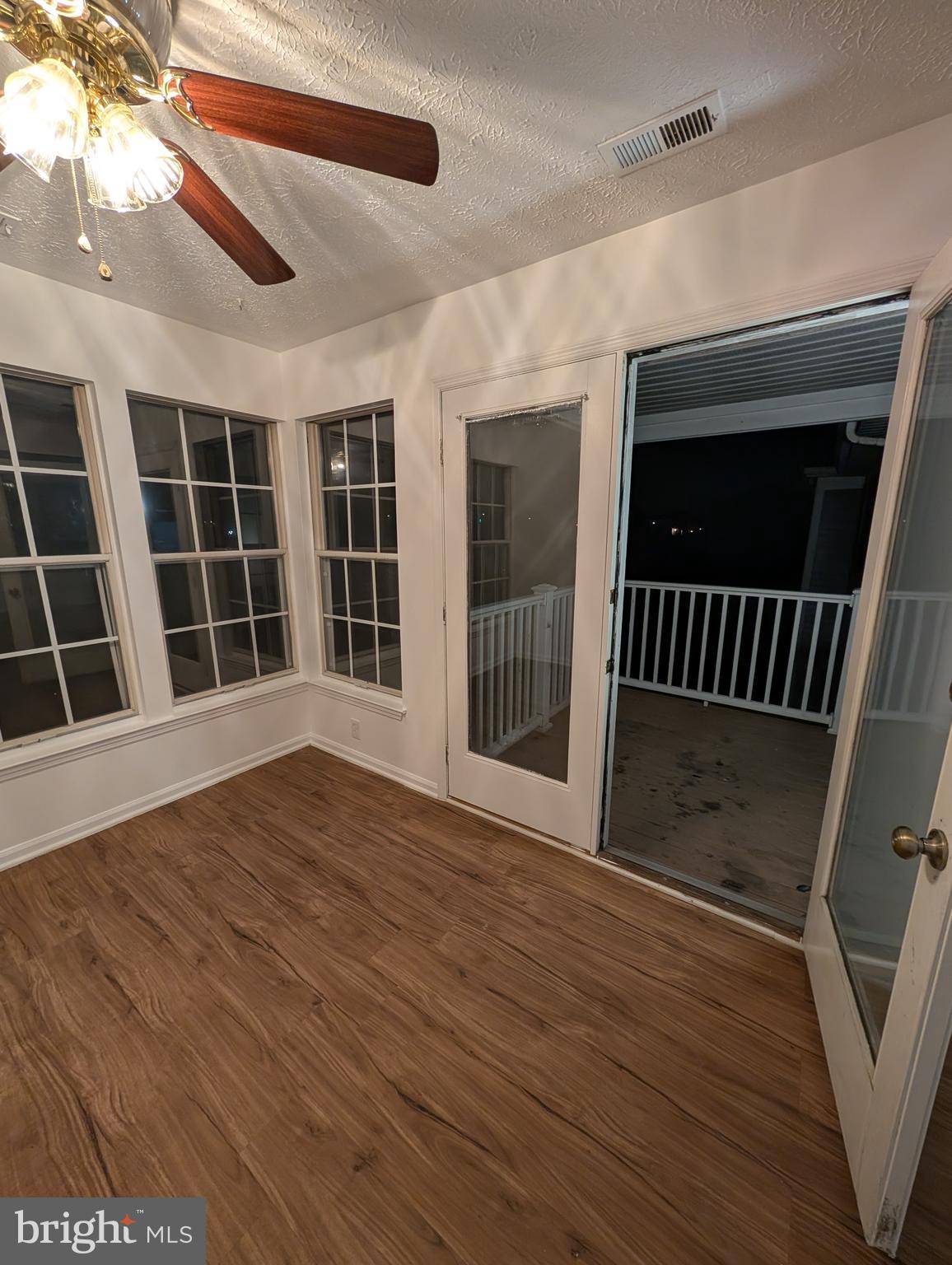 1301 L Cedar Crest Court, Unit 1301L Edgewood, MD 21040 - Photo 37 of 43 a view of empty room with wooden floor and fan