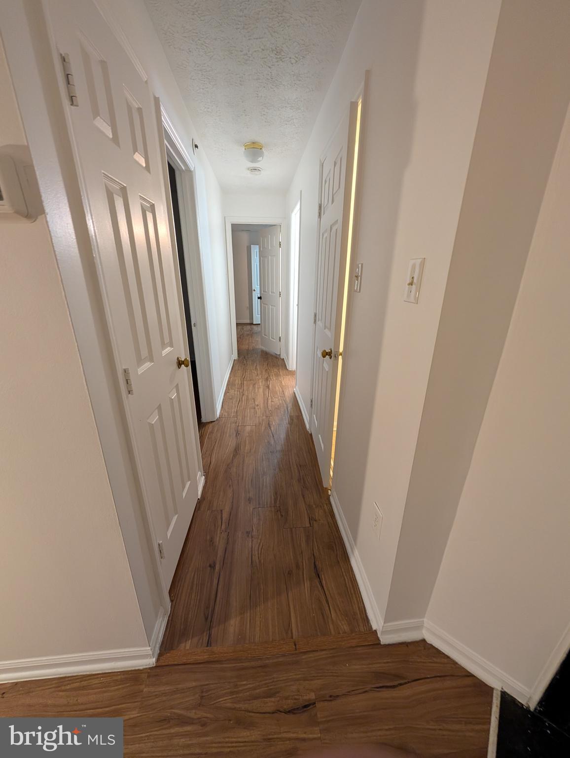 1301 L Cedar Crest Court, Unit 1301L Edgewood, MD 21040 - Photo 38 of 43 a view of a hallway with wooden floor