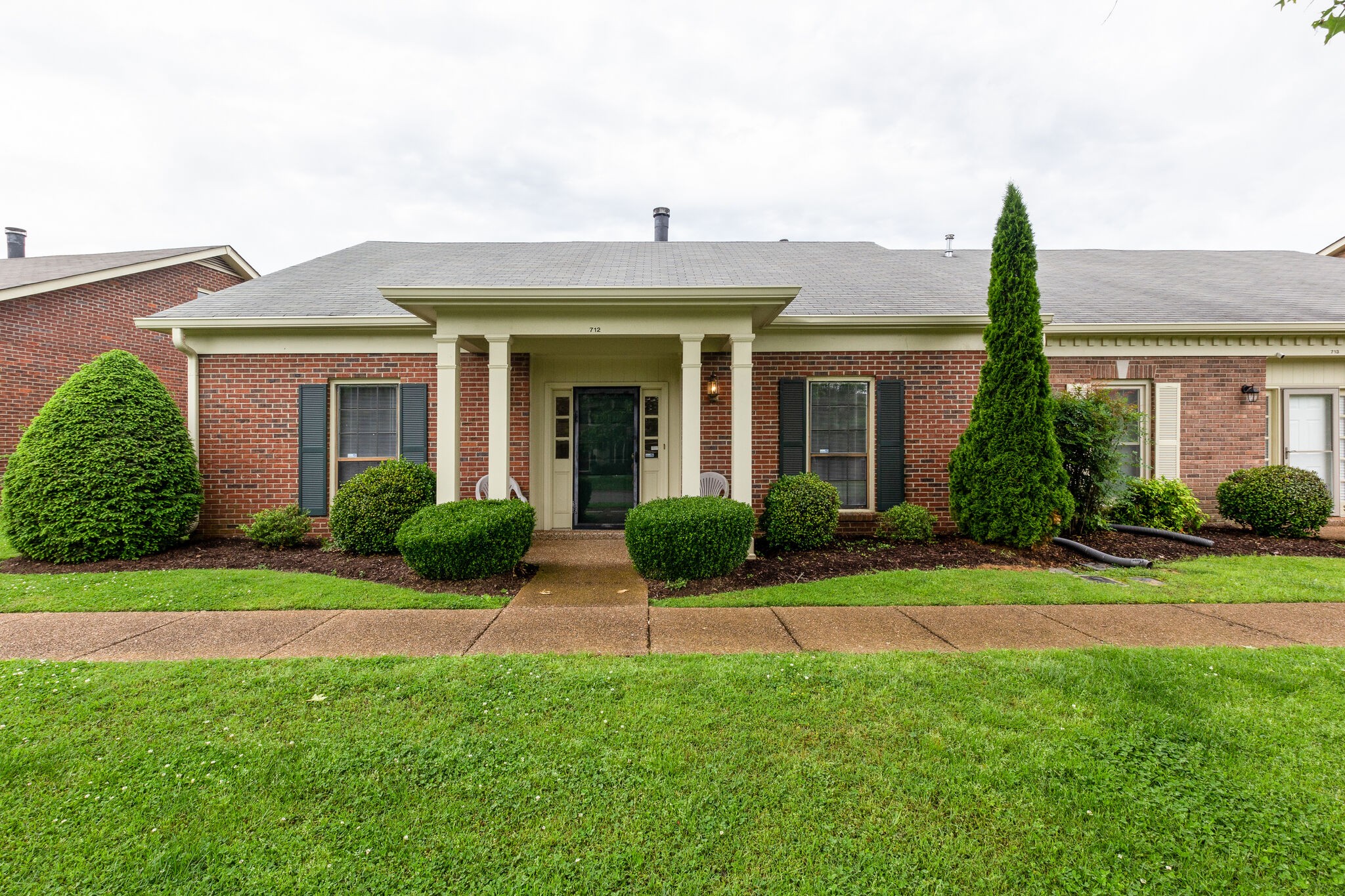712 General George Patton Road Nashville, TN 37221 - Photo 1 of 35 a front view of a house with a garden
