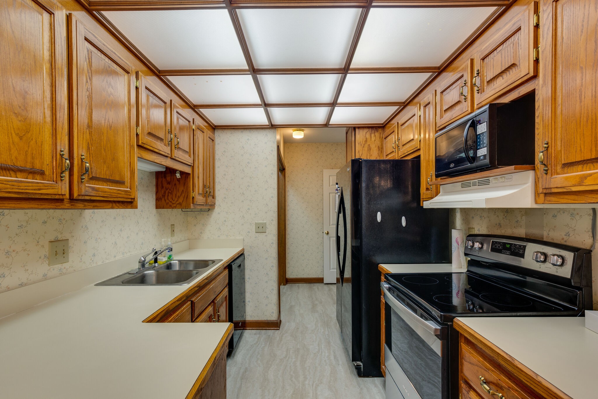 712 General George Patton Road Nashville, TN 37221 - Photo 12 of 35 a kitchen with stainless steel appliances granite countertop a refrigerator a stove and a sink with wooden floor