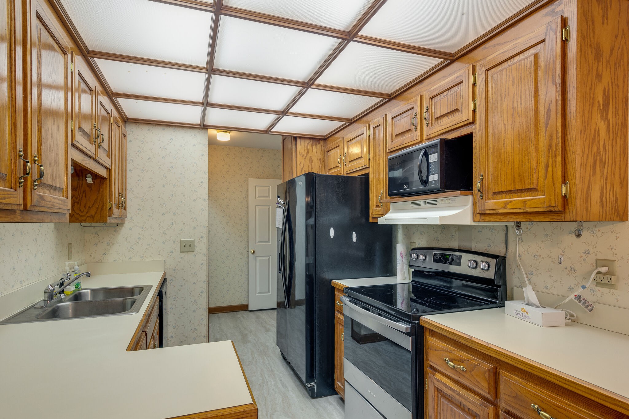 712 General George Patton Road Nashville, TN 37221 - Photo 13 of 35 a kitchen with stainless steel appliances granite countertop a refrigerator a stove top oven a sink and dishwasher