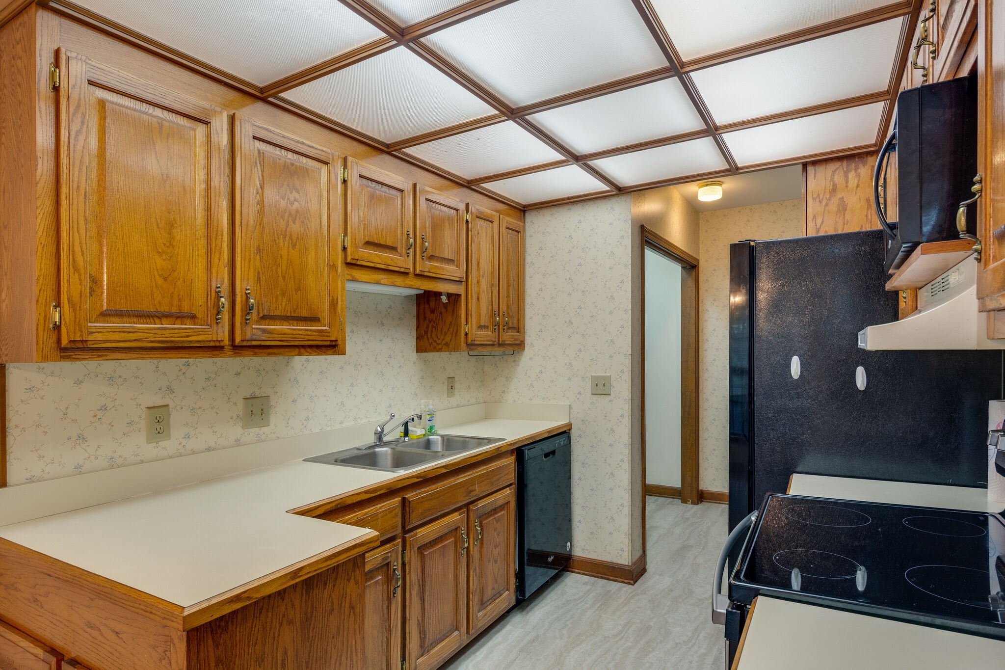 712 General George Patton Road Nashville, TN 37221 - Photo 14 of 35 a kitchen with stainless steel appliances a sink stove and cabinets