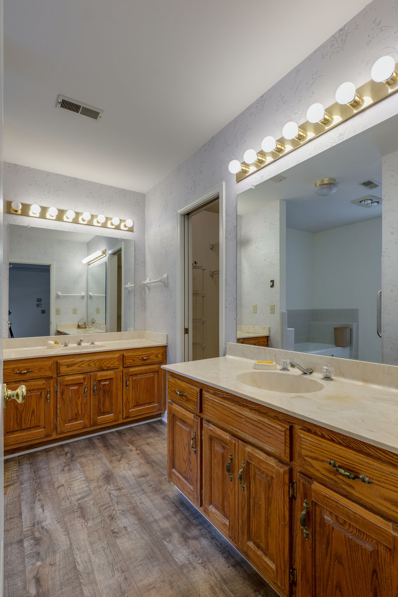 712 General George Patton Road Nashville, TN 37221 - Photo 19 of 35 a spacious bathroom with a granite countertop double vanity sink a mirror and a bathtub