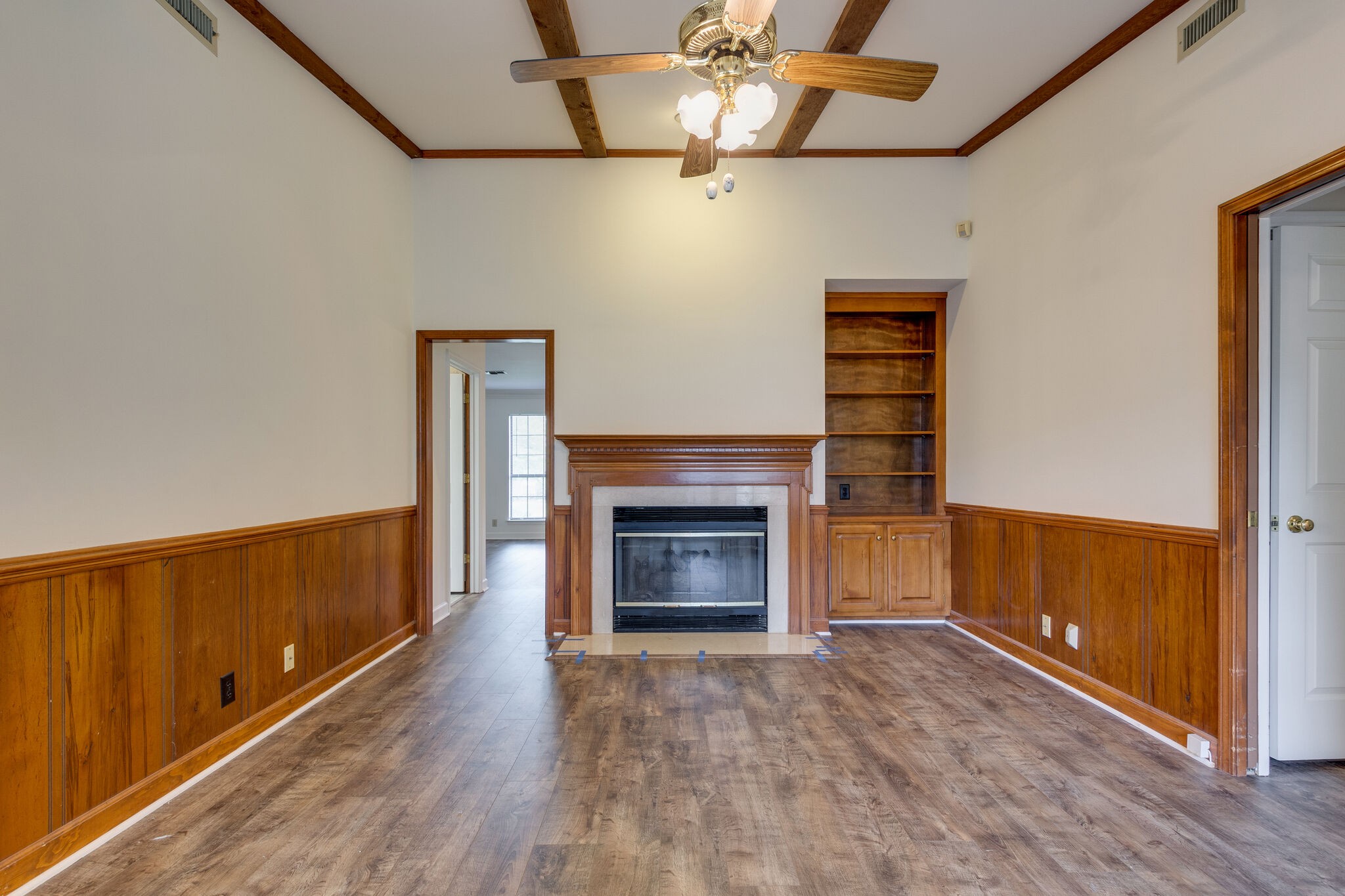 712 General George Patton Road Nashville, TN 37221 - Photo 10 of 35 a view of an empty room with wooden floor fireplace and a window