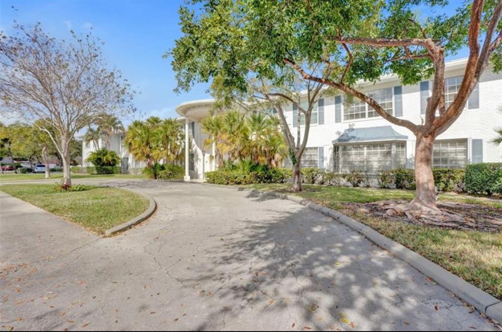 6750 Northeast 21st Road, Unit 123 Fort Lauderdale, FL 33308 - Photo 12 of 12 a view of a house with trees in the background