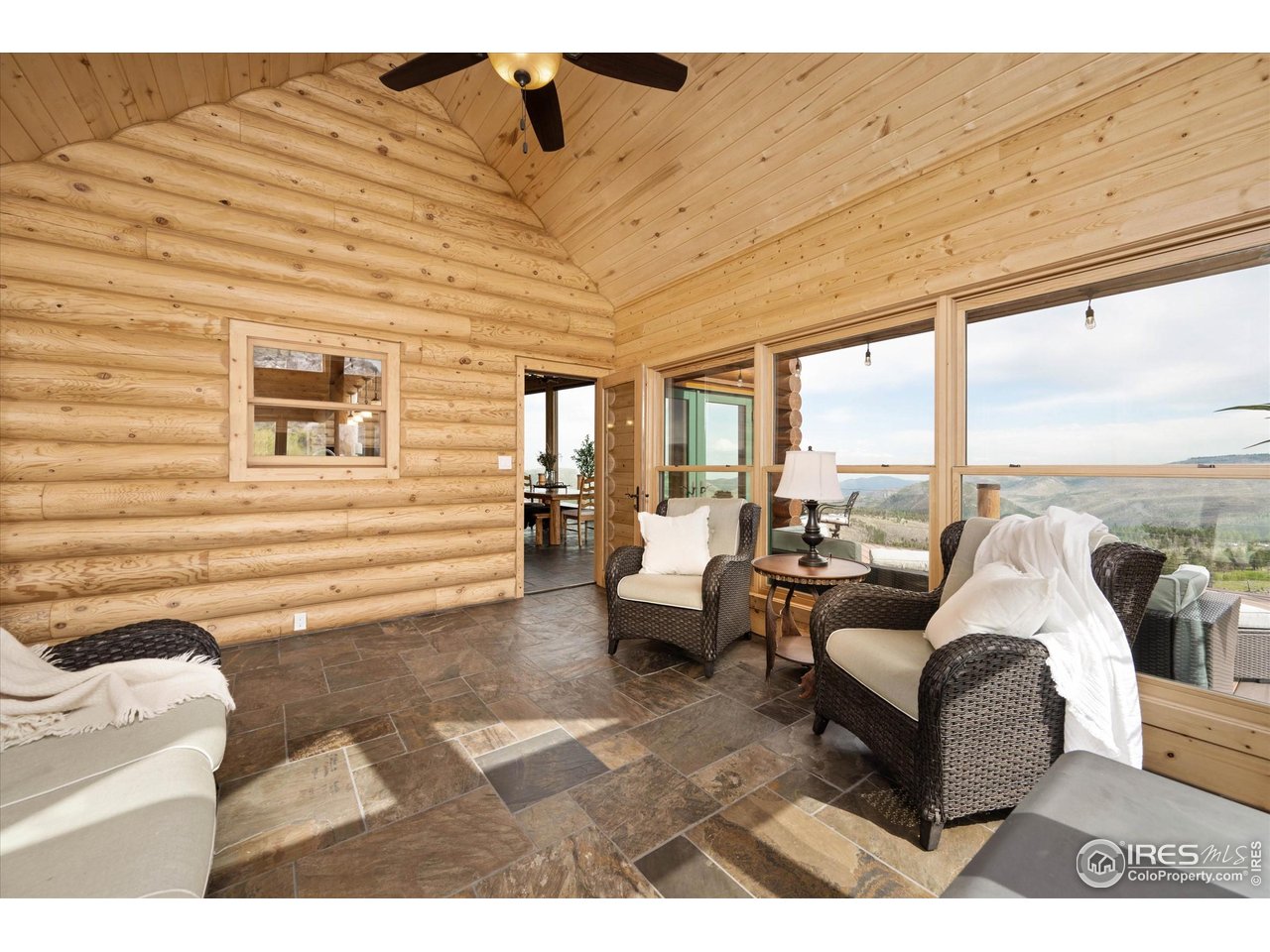 4119 Davis Ranch Road Bellvue, CO 80512 - Photo 17 of 40 a living room with furniture and a large window