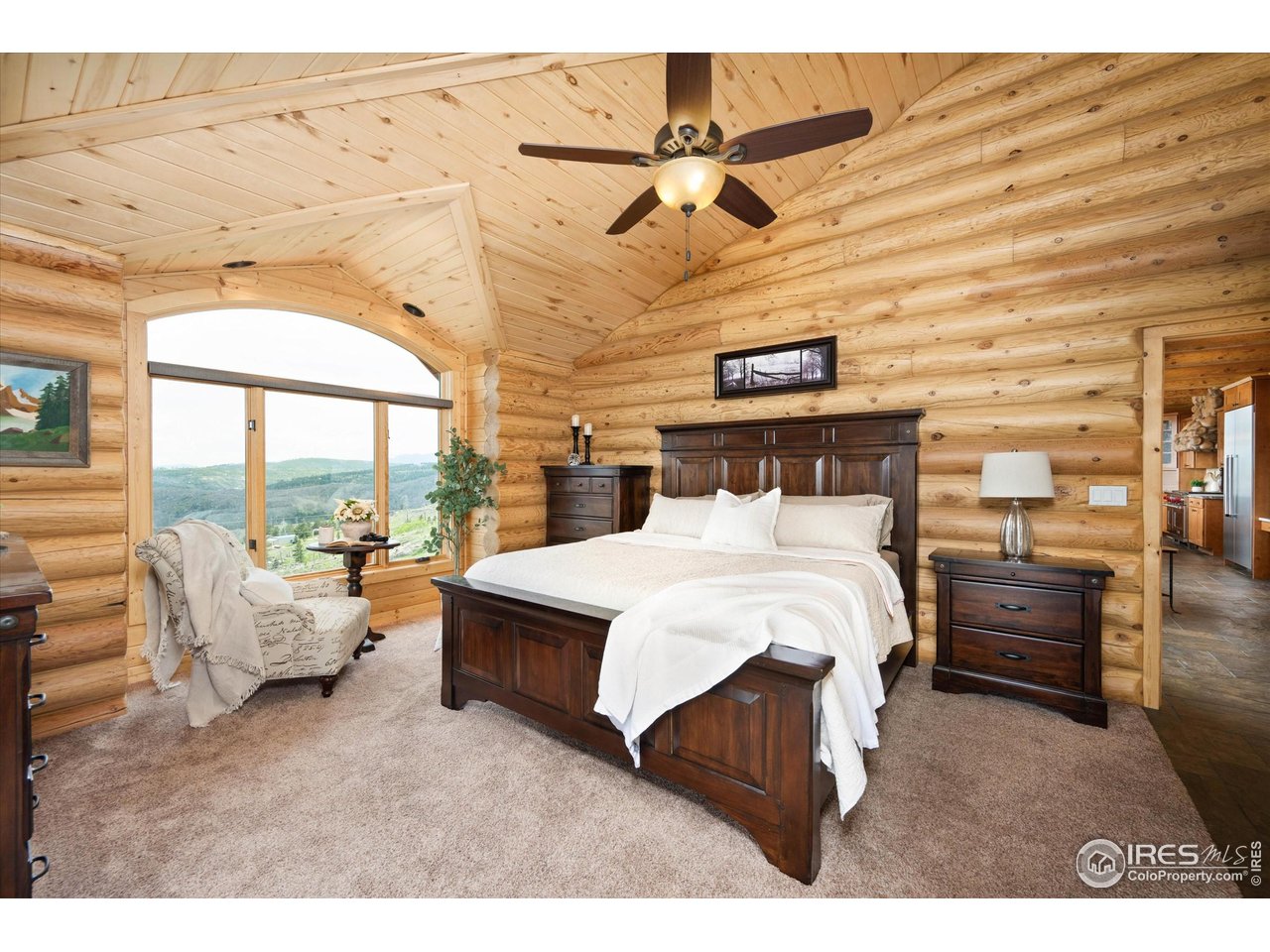 4119 Davis Ranch Road Bellvue, CO 80512 - Photo 20 of 40 a bed room with a bed and a large window