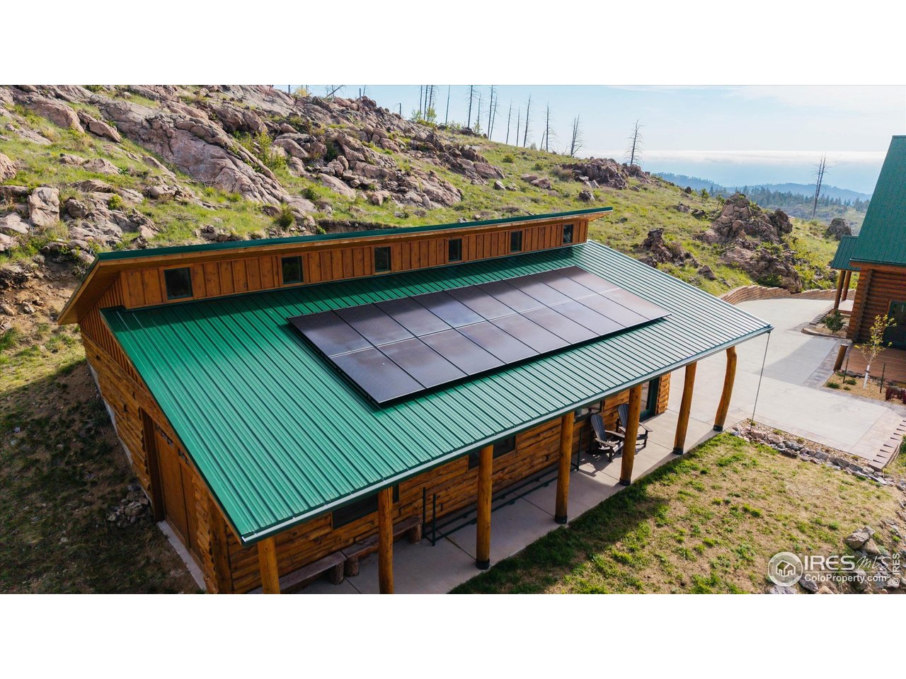 4119 Davis Ranch Road Bellvue, CO 80512 - Photo 36 of 40 a view of a backyard with sitting area