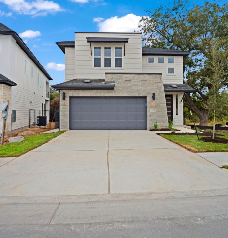 1612 Kit Circle Austin, TX 78758 - Photo 1 of 1 a front view of a house with a yard