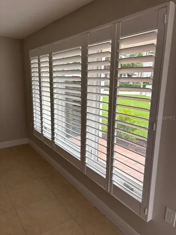 a view of a room that has a window in it