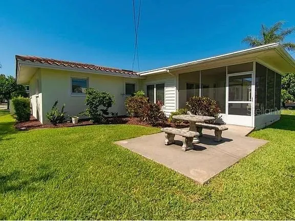a house with palm tree in front of it