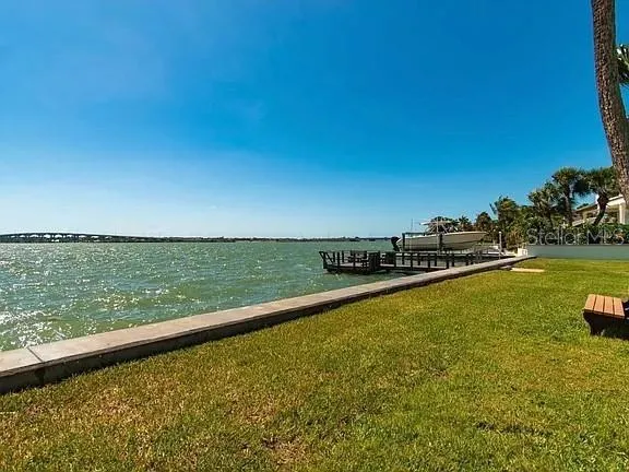 a view of a swimming pool with a table and chairs