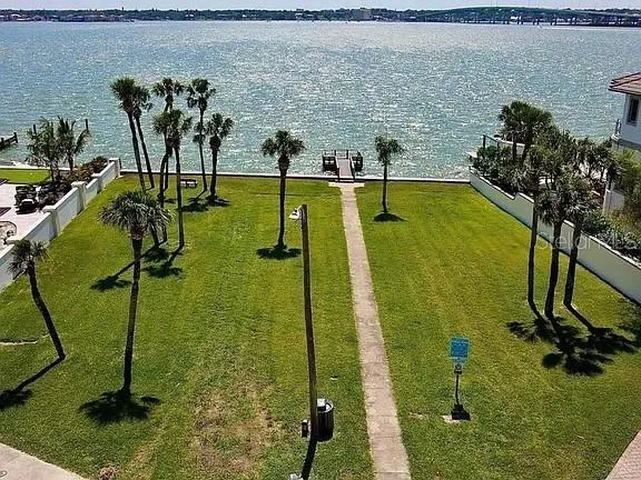 an aerial view of a houses with a lake view