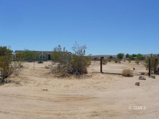 770 Alpine Way Ridgecrest, CA 93555 - Photo 47 of 50 a view of a dry yard with wooden fence