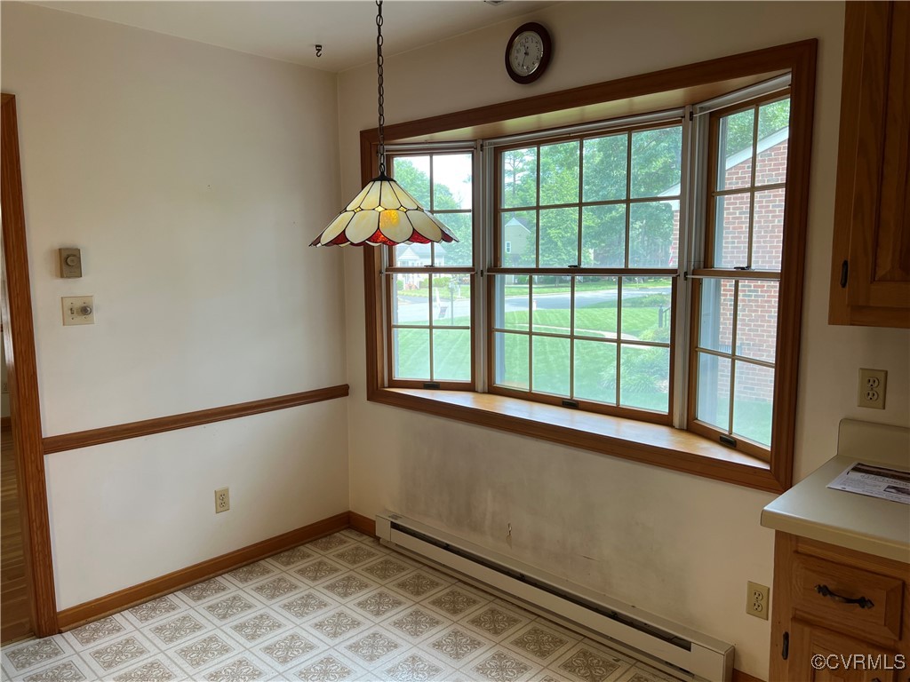 8426 Forge Road Henrico, VA 23228 - Photo 11 of 46 Unfurnished dining area with a baseboard heating u