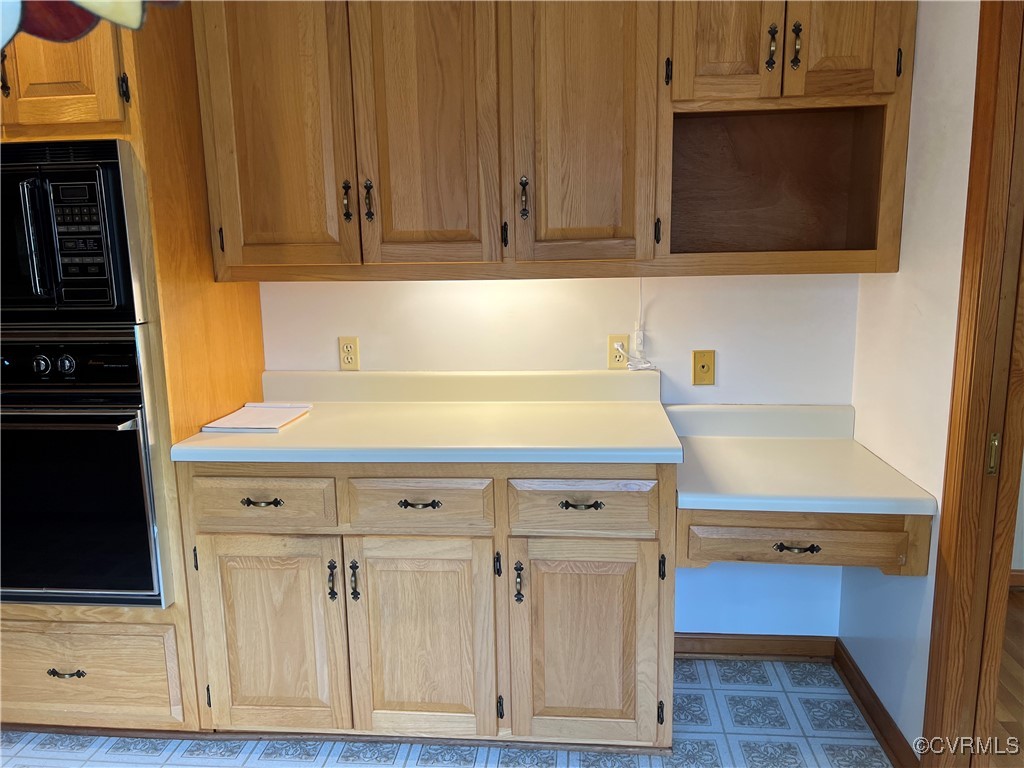 8426 Forge Road Henrico, VA 23228 - Photo 13 of 46 Kitchen featuring black appliances, light countert