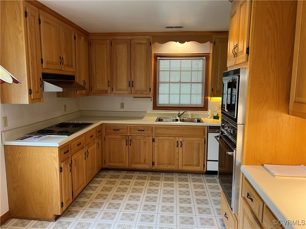 8426 Forge Road Henrico, VA 23228 - Photo 14 of 46 Kitchen featuring under cabinet range hood, white
