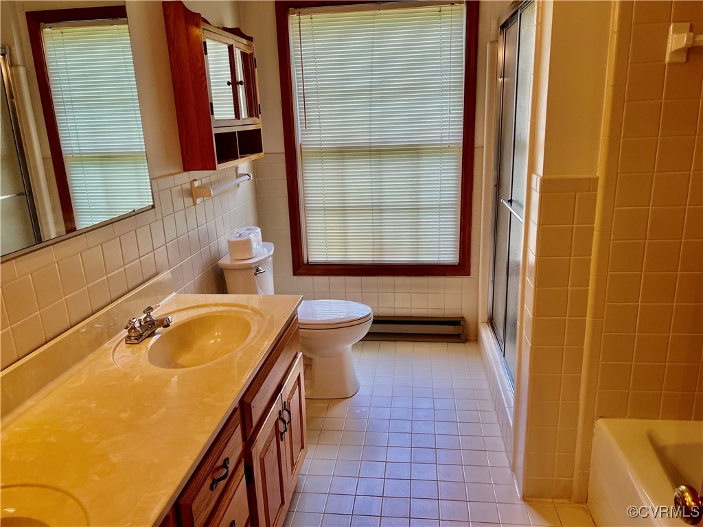 8426 Forge Road Henrico, VA 23228 - Photo 20 of 46 Full bath with tile walls, a baseboard radiator, d