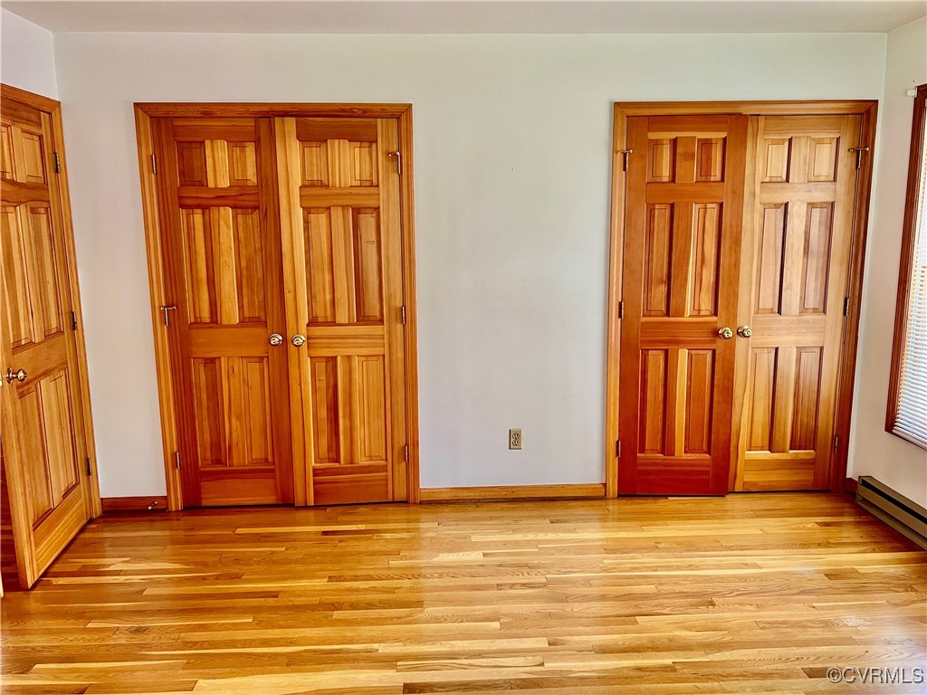 8426 Forge Road Henrico, VA 23228 - Photo 24 of 46 Unfurnished bedroom featuring light wood finished
