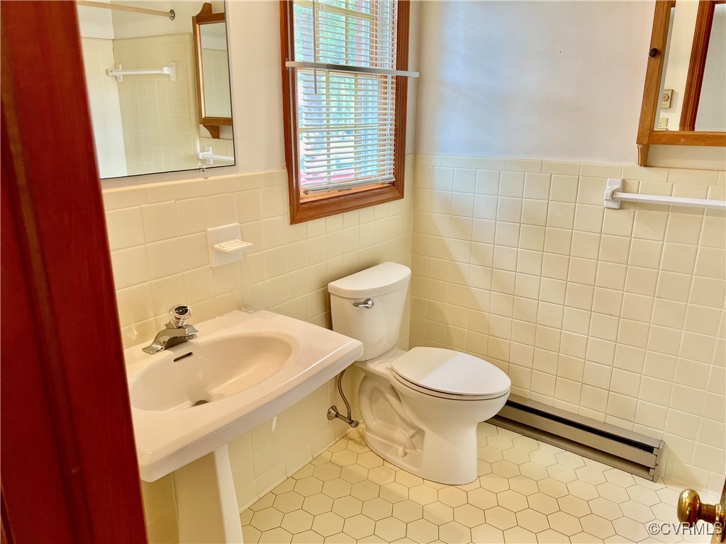 8426 Forge Road Henrico, VA 23228 - Photo 30 of 46 Bathroom with baseboard heating, tile walls, a wai