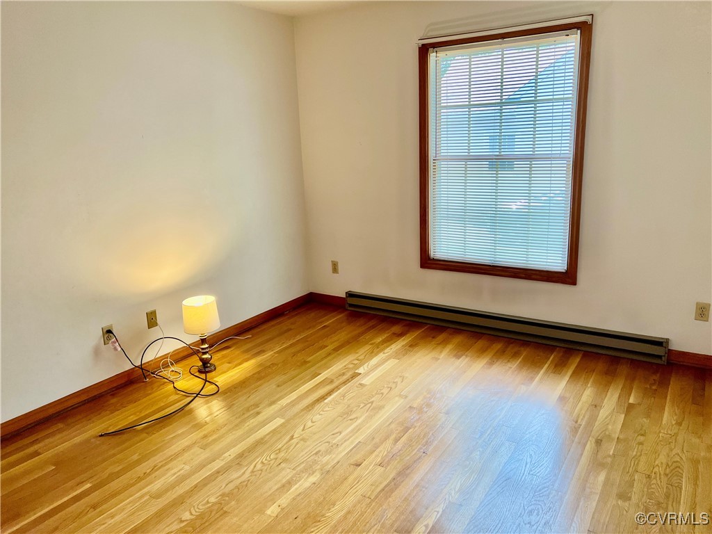 8426 Forge Road Henrico, VA 23228 - Photo 35 of 46 Unfurnished room featuring a baseboard heating uni