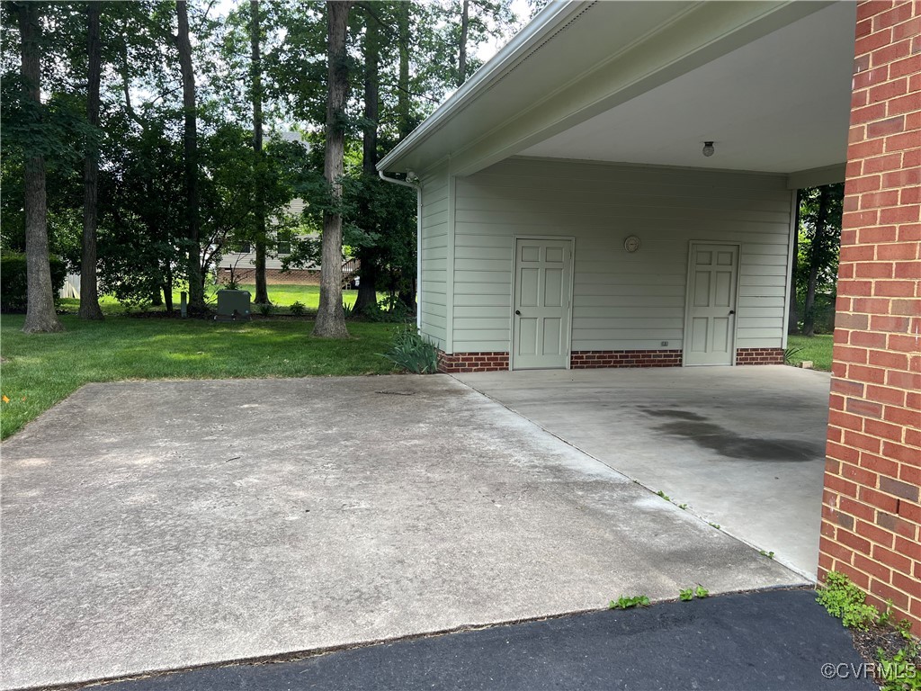 8426 Forge Road Henrico, VA 23228 - Photo 4 of 46 View of patio / terrace with driveway and a carpor