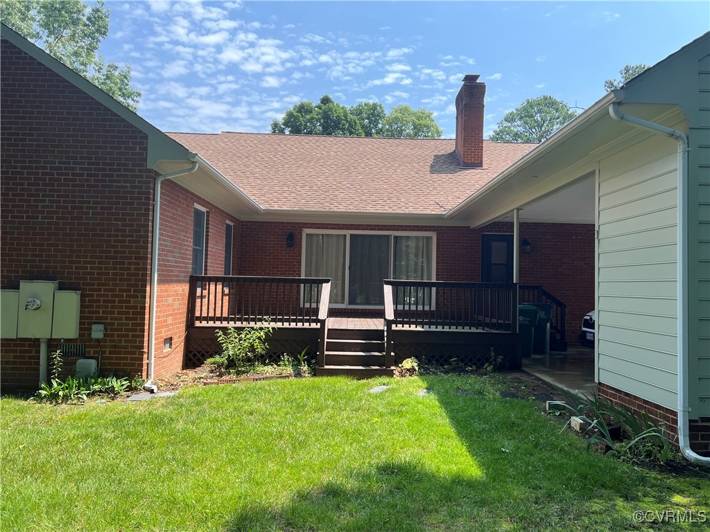 8426 Forge Road Henrico, VA 23228 - Photo 43 of 46 Rear view of house featuring a deck, a chimney, a