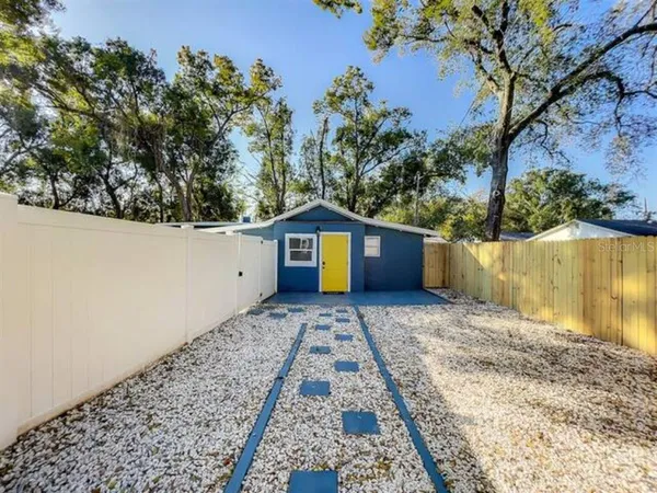 a view of a yard with a large trees