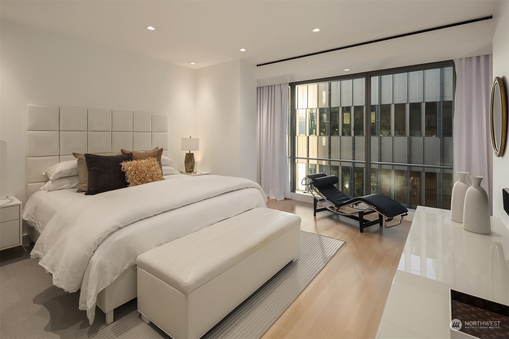 99 Union Street, Unit 1104 Seattle, WA 98101 - Photo 20 of 38 a bedroom with furniture and a large window