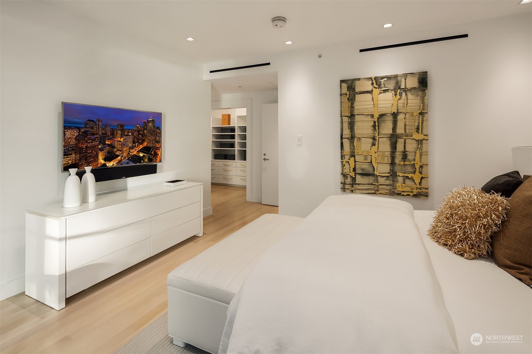 99 Union Street, Unit 1104 Seattle, WA 98101 - Photo 21 of 38 a bedroom with a bed and a flat screen tv