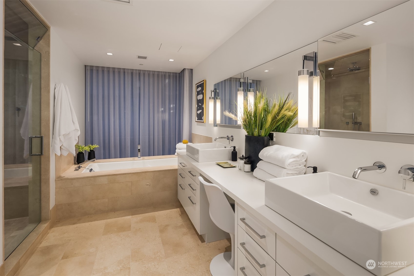 99 Union Street, Unit 1104 Seattle, WA 98101 - Photo 22 of 38 a bathroom with a bathtub sink and mirror