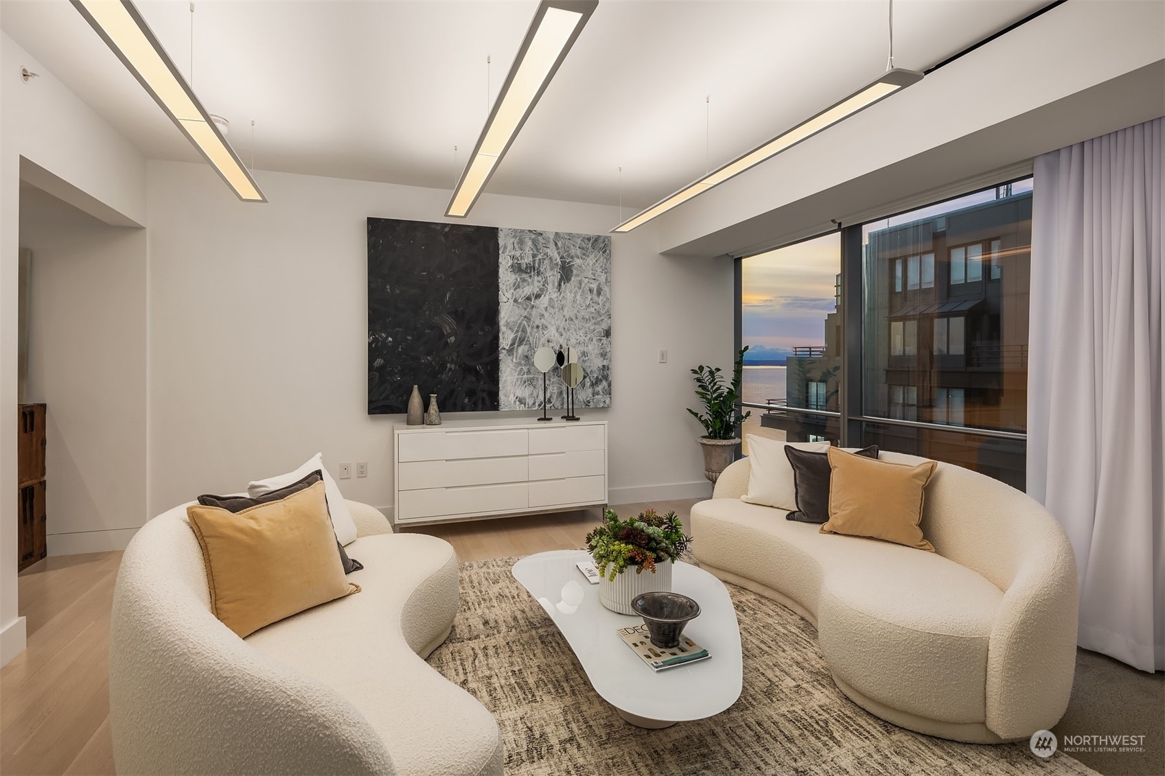 99 Union Street, Unit 1104 Seattle, WA 98101 - Photo 24 of 38 a living room with furniture and a large window
