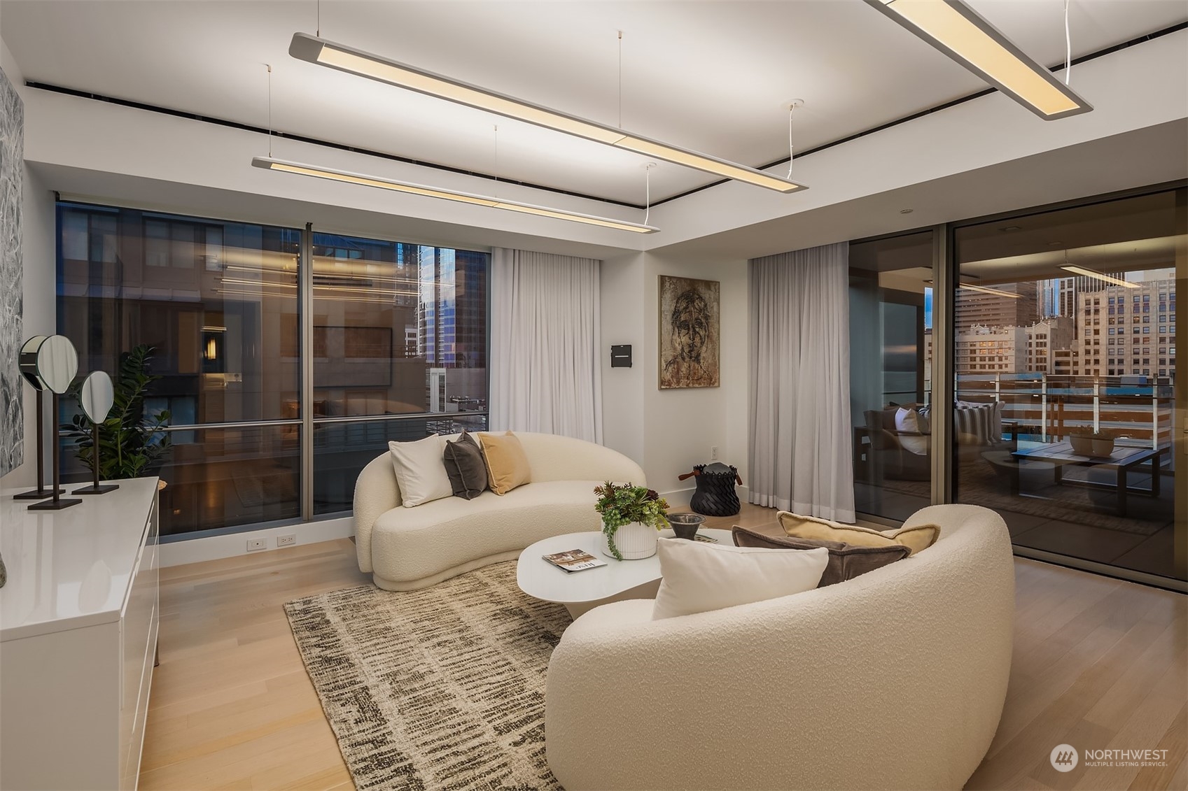 99 Union Street, Unit 1104 Seattle, WA 98101 - Photo 25 of 38 a living room with furniture and a large window