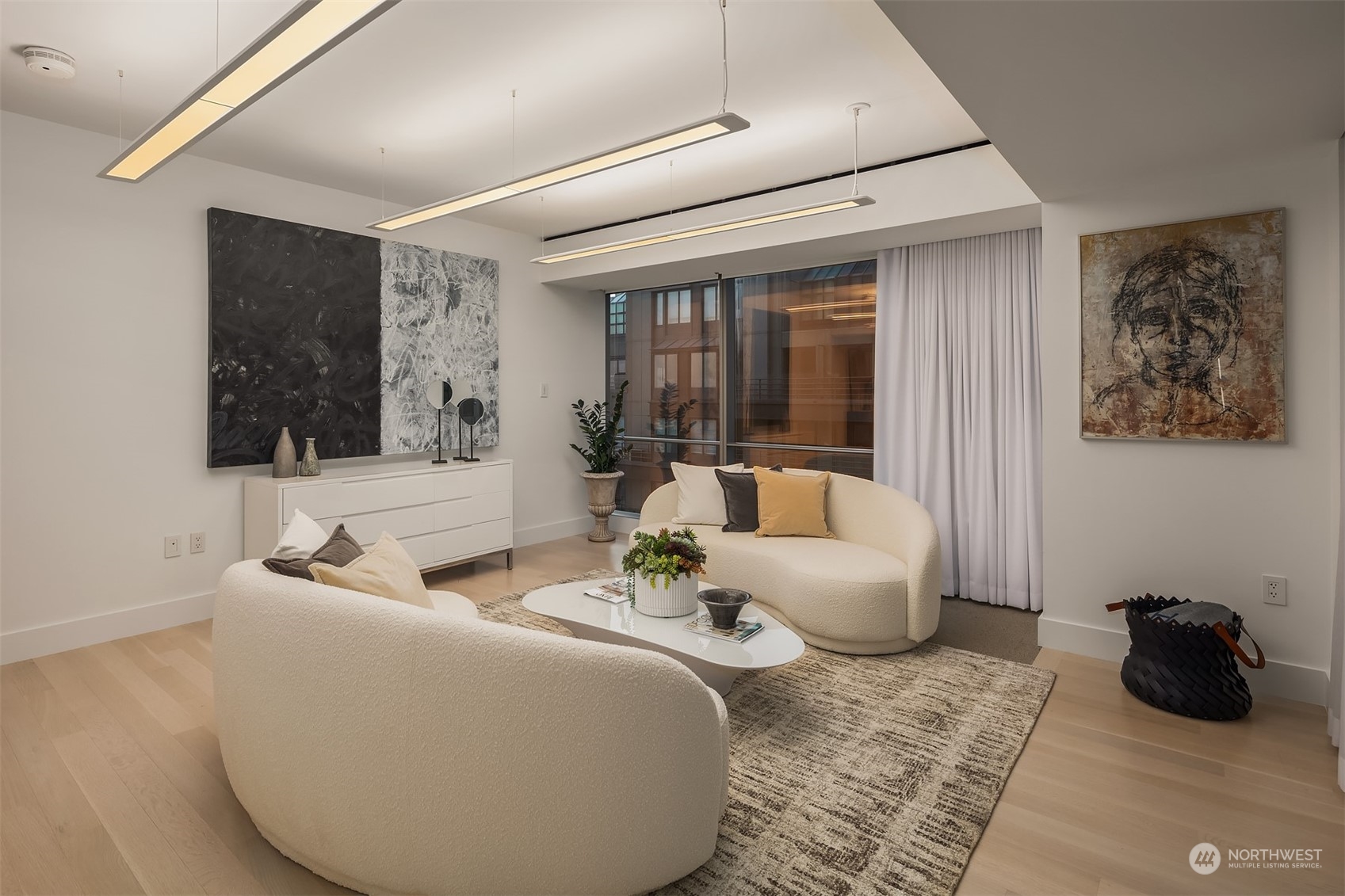 99 Union Street, Unit 1104 Seattle, WA 98101 - Photo 26 of 38 a living room with furniture and a large window